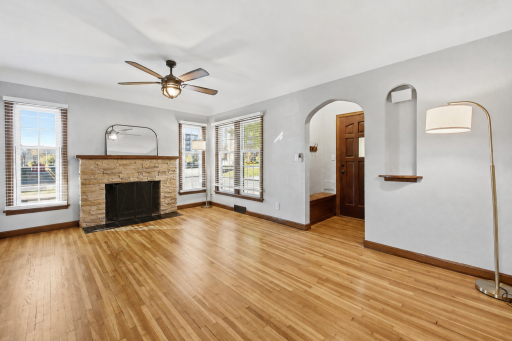 Upon entering the home, you are greeted by this large living room with gorgeous hardwood floors.