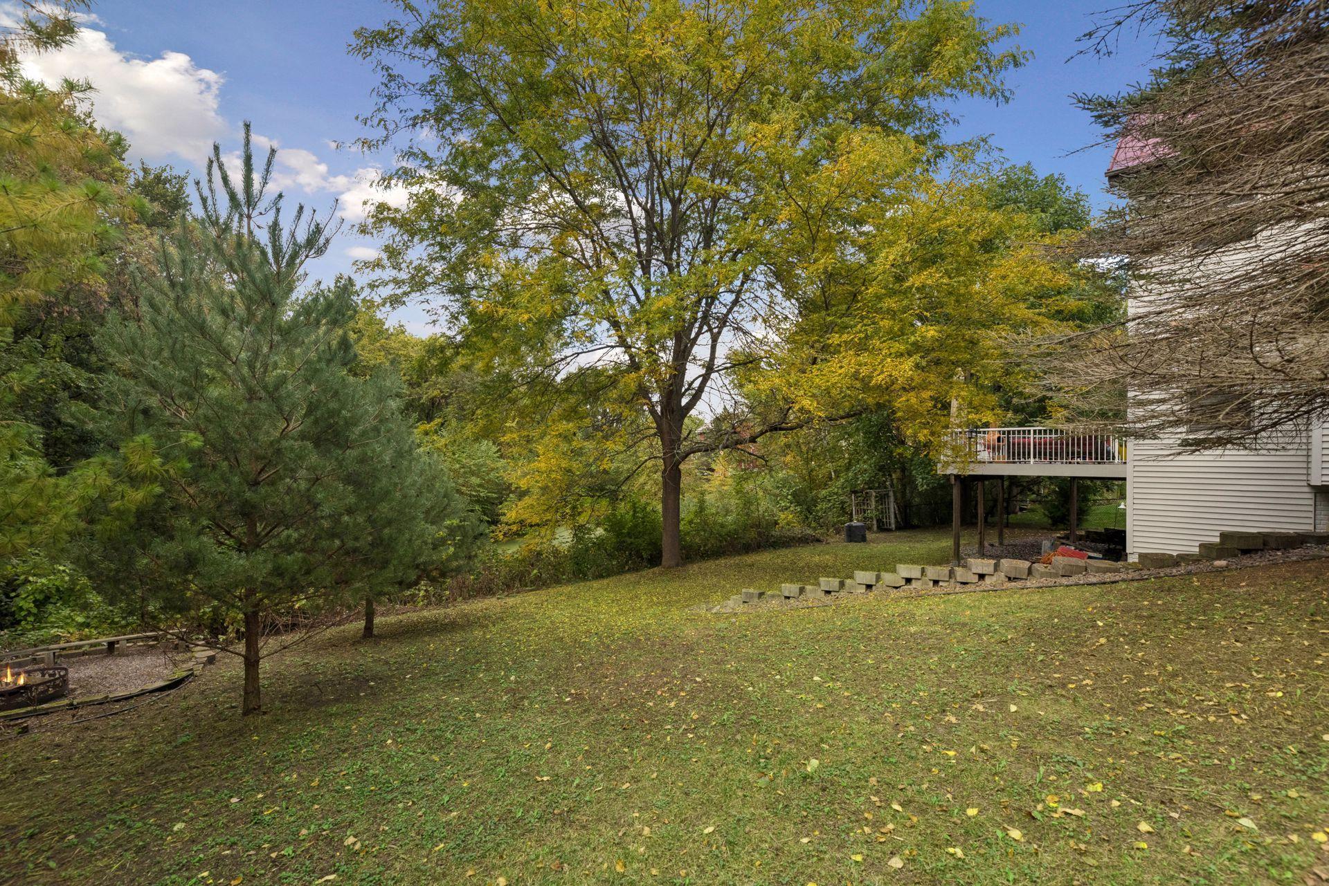 The expansive backyard overlooks a peaceful pond, creating a beautiful and private setting right at home.