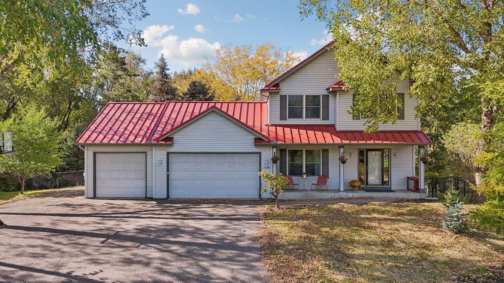 Spacious three-car attached garage with an additional parking pad, all tucked away in a quiet cul-de-sac setting.