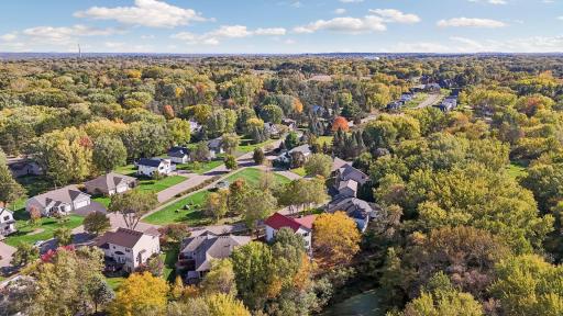 What a setting! Enjoy peaceful pond views behind the home and a wonderful park across the street, offering beautiful green space in every direction.