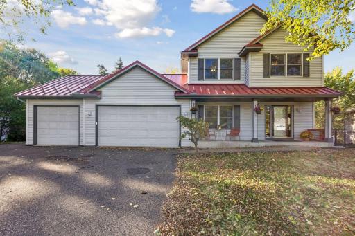 From the street, this home makes a lasting impression with its charming covered front porch, distinctive metal roof, and quiet cul-de-sac location.