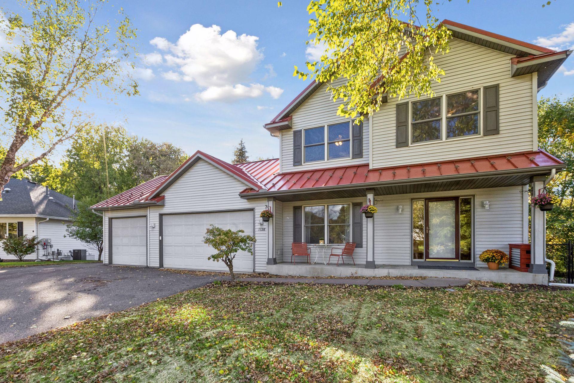 A beautiful view from the street showcases the home's impressive presence, welcoming curb appeal, and peaceful cul-de-sac setting.