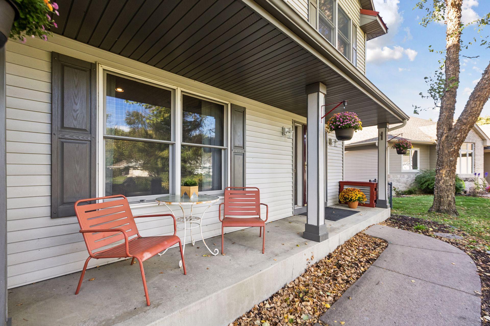The inviting covered front porch is the perfect place to relax, welcome guests, or watch the kids play in the open green space across the street.