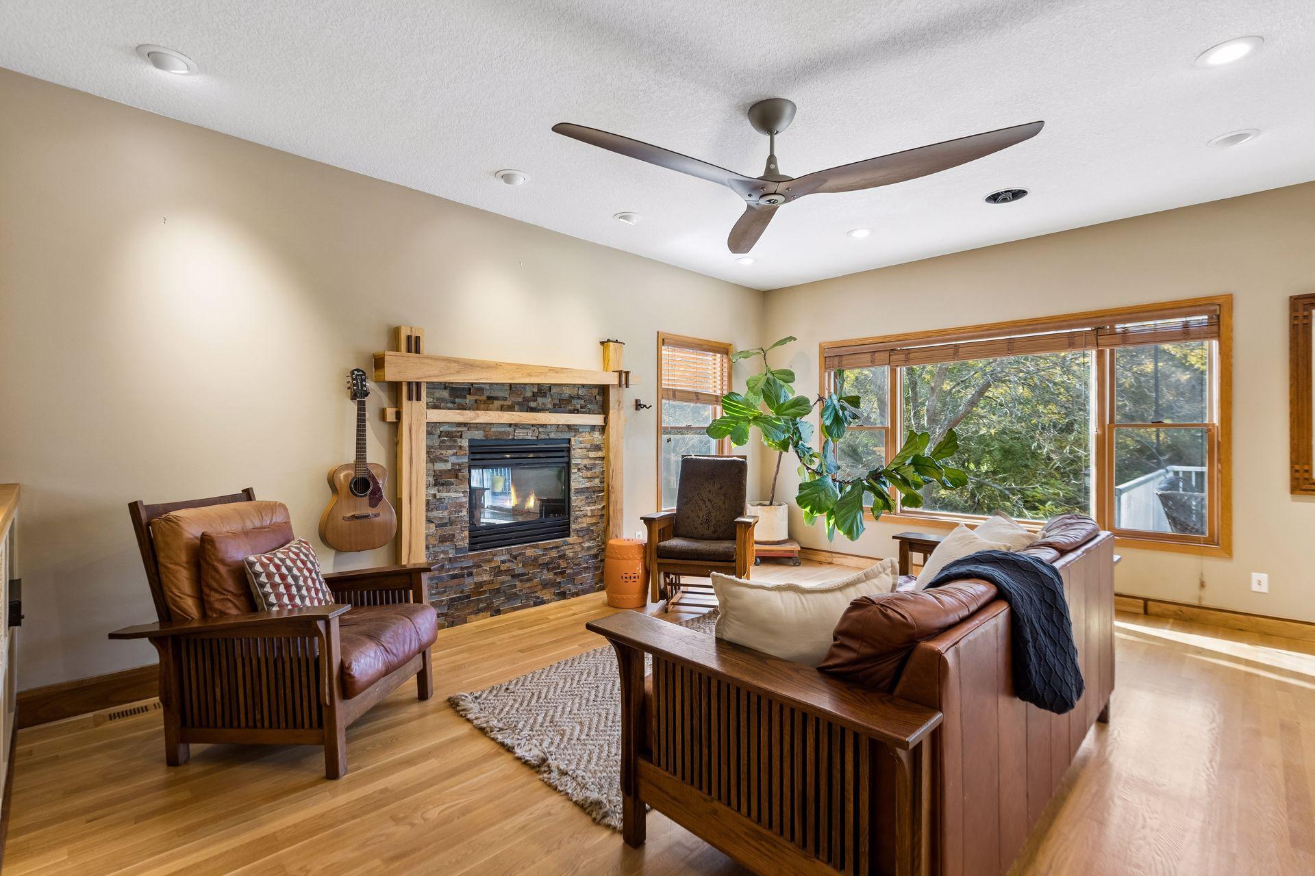 Welcome to the living room, where a cozy gas fireplace, beautiful finishes, and thoughtful design create an inviting gathering space.