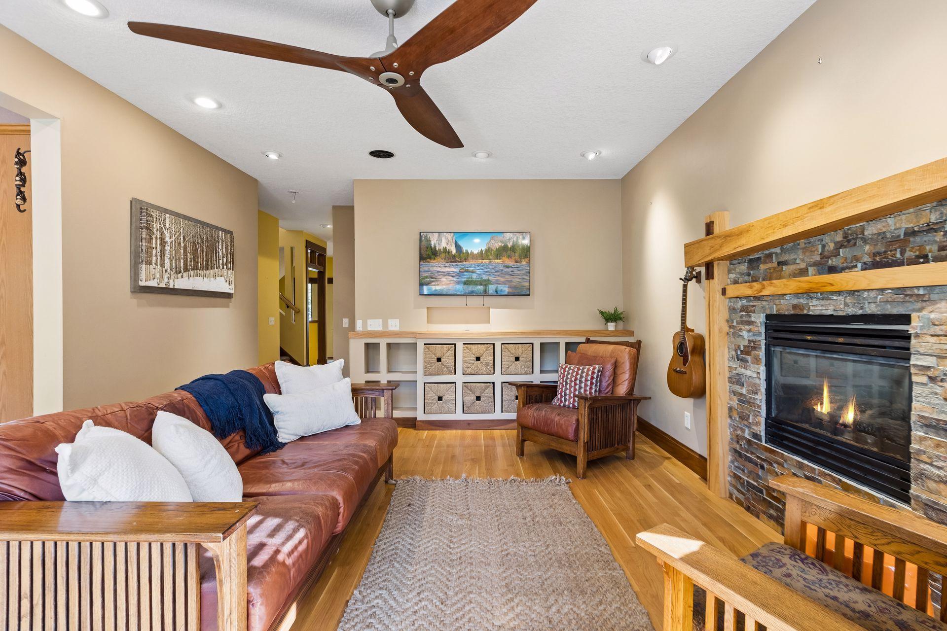 Another view of the inviting living room, where custom built-ins and a beautiful gas fireplace create the perfect place to unwind.