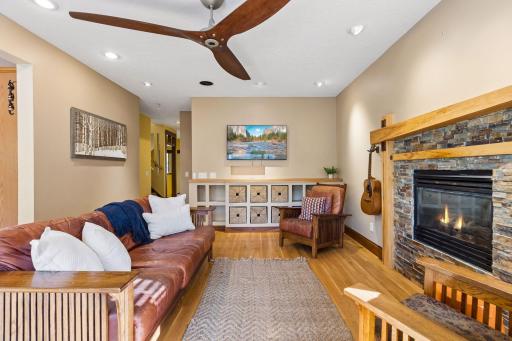 Another view of the inviting living room, where custom built-ins and a beautiful gas fireplace create the perfect place to unwind.