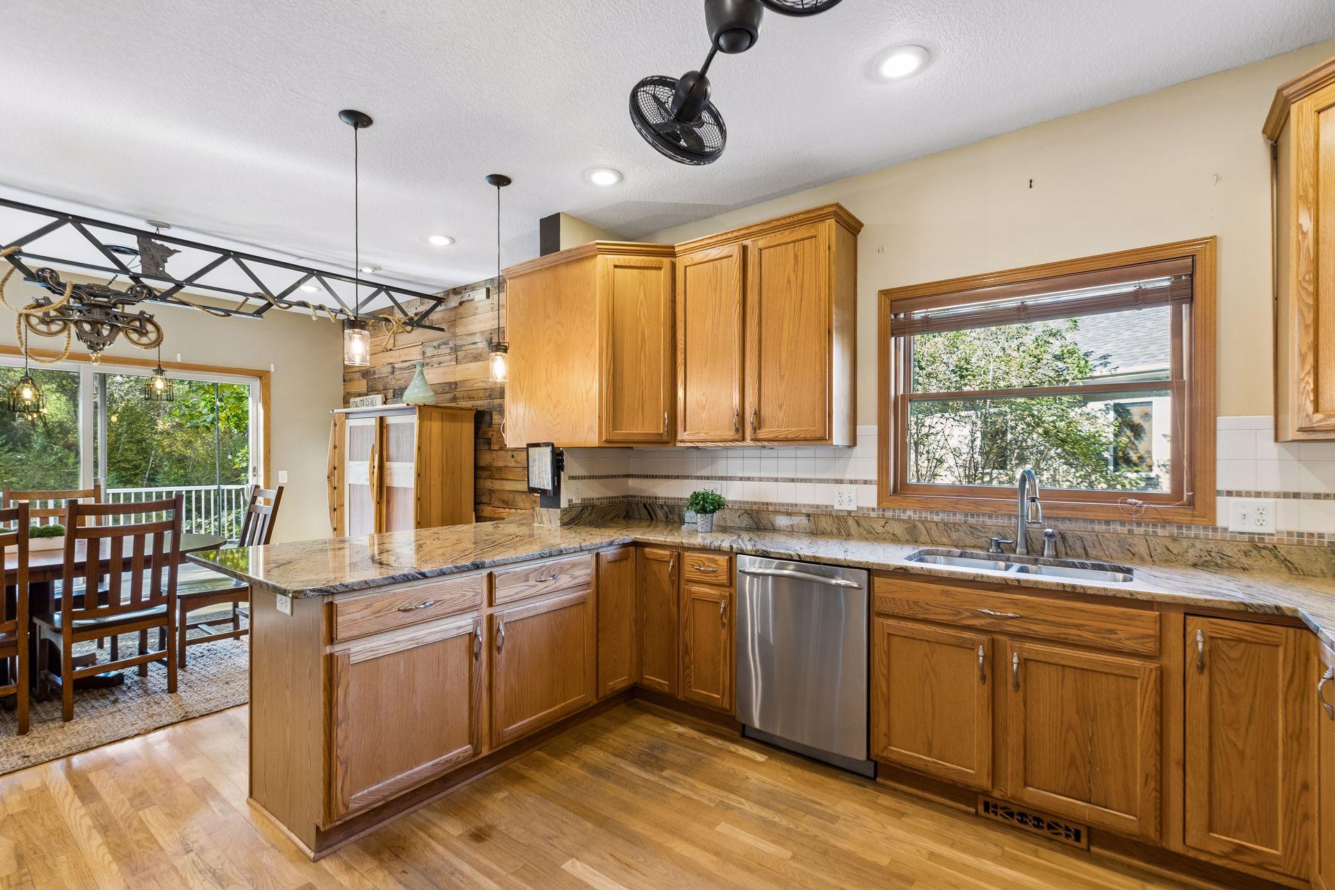 The spacious kitchen island is sure to become a favorite gathering spot, complemented by an incredible amount of counter space for everyday living and entertaining.