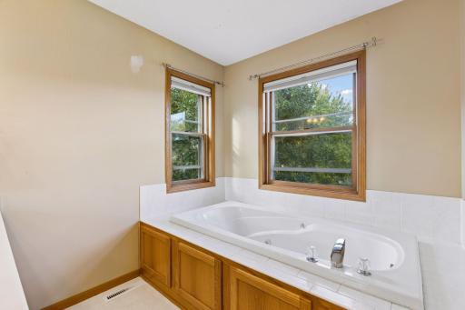 Imagine soaking in the bathtub while enjoying tranquil views of the private backyard and surrounding nature.