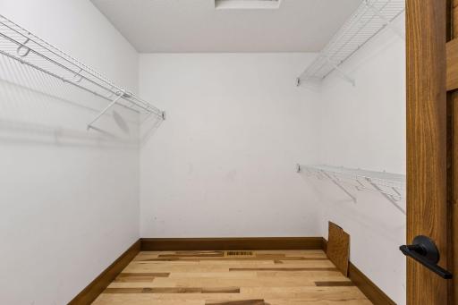 The primary suite's generous walk-in closet provides wonderful storage and organization.