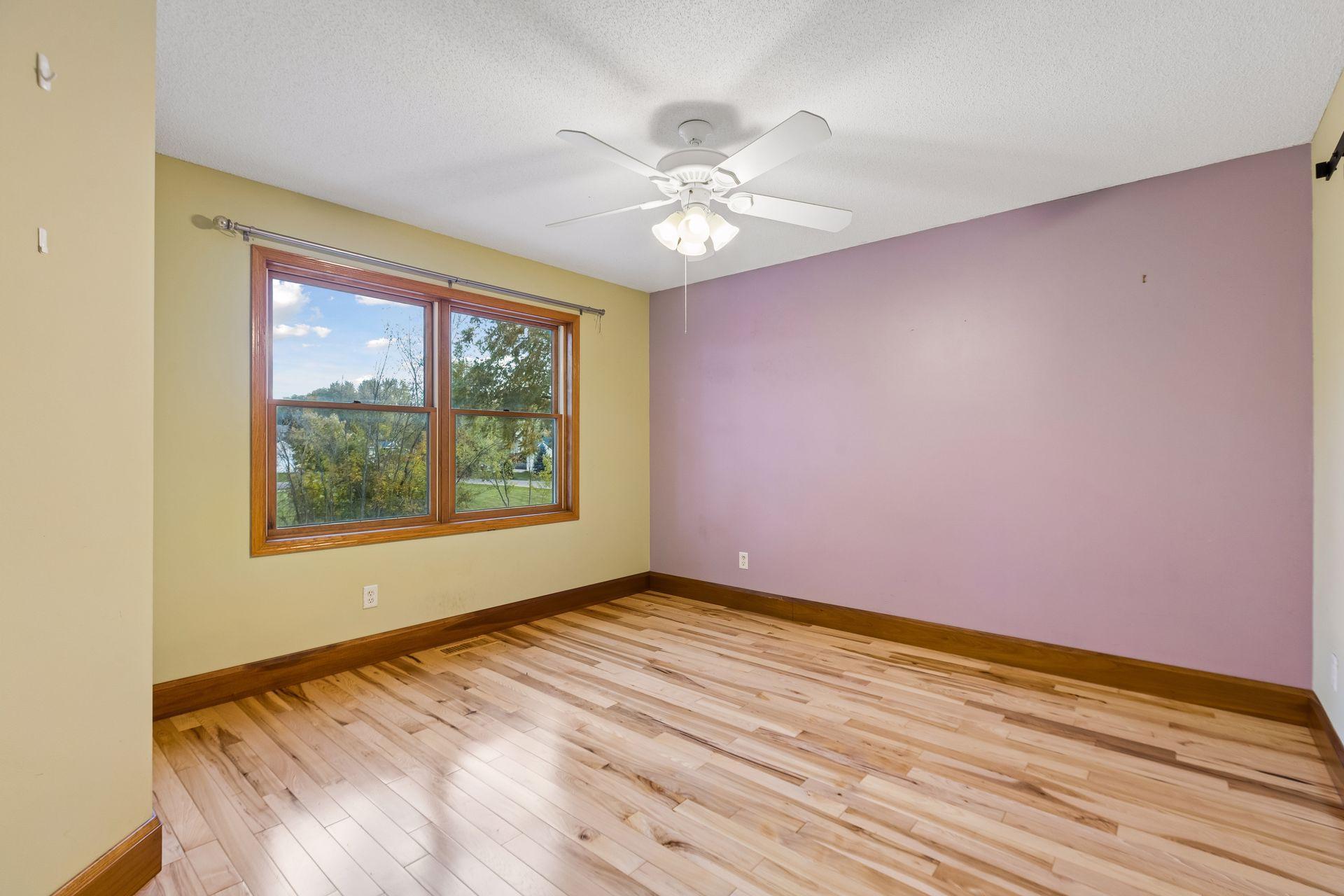 Upper-level bedroom three provides another versatile space, perfect for family, guests, or a home office.