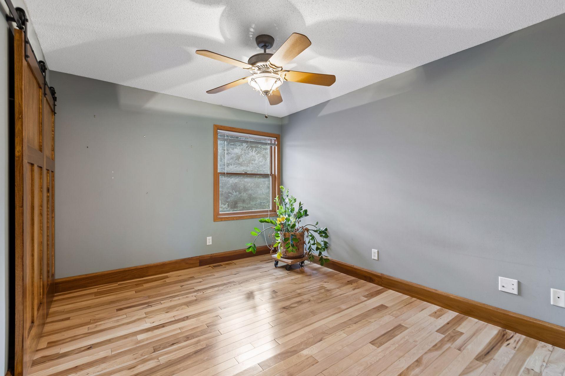 Upper-level bedroom four provides another versatile space, perfect for family, guests, or a home office.