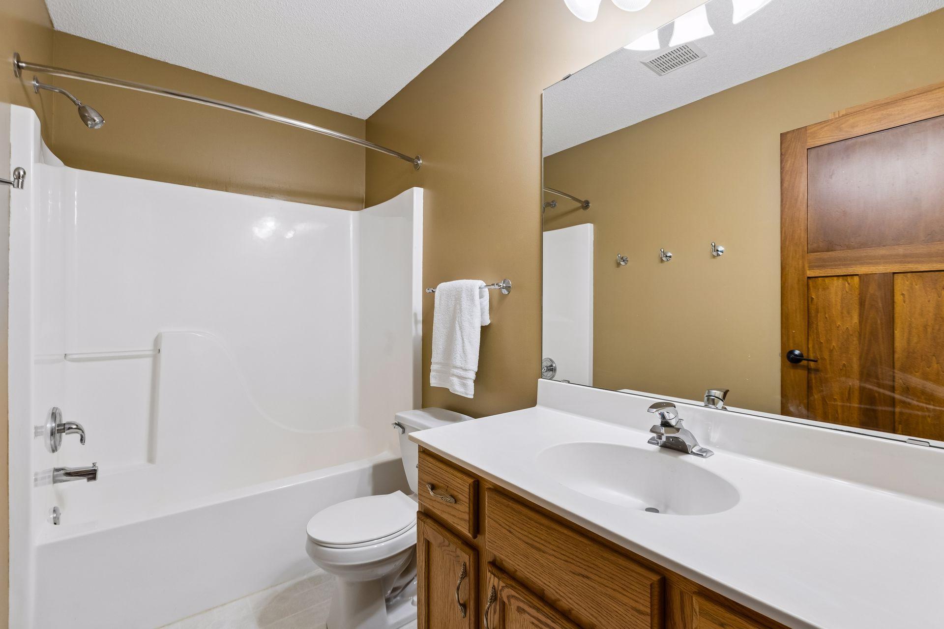 A full bathroom on the upper level conveniently serves the additional bedrooms.