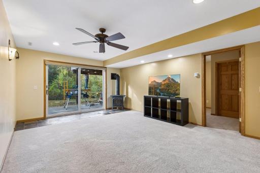 A freestanding wood-burning stove creates a cozy atmosphere, perfect for relaxing on chilly Minnesota evenings.