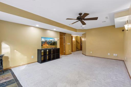 The expansive lower-level recreation room offers endless possibilities for entertaining, movie nights, games, and gathering with friends and family.