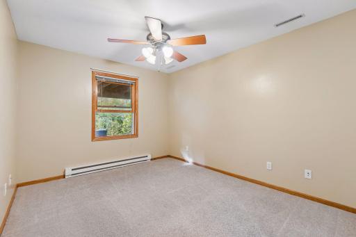 The home's fifth bedroom is located in the lower level, offering a wonderful private space for guests or additional household members.