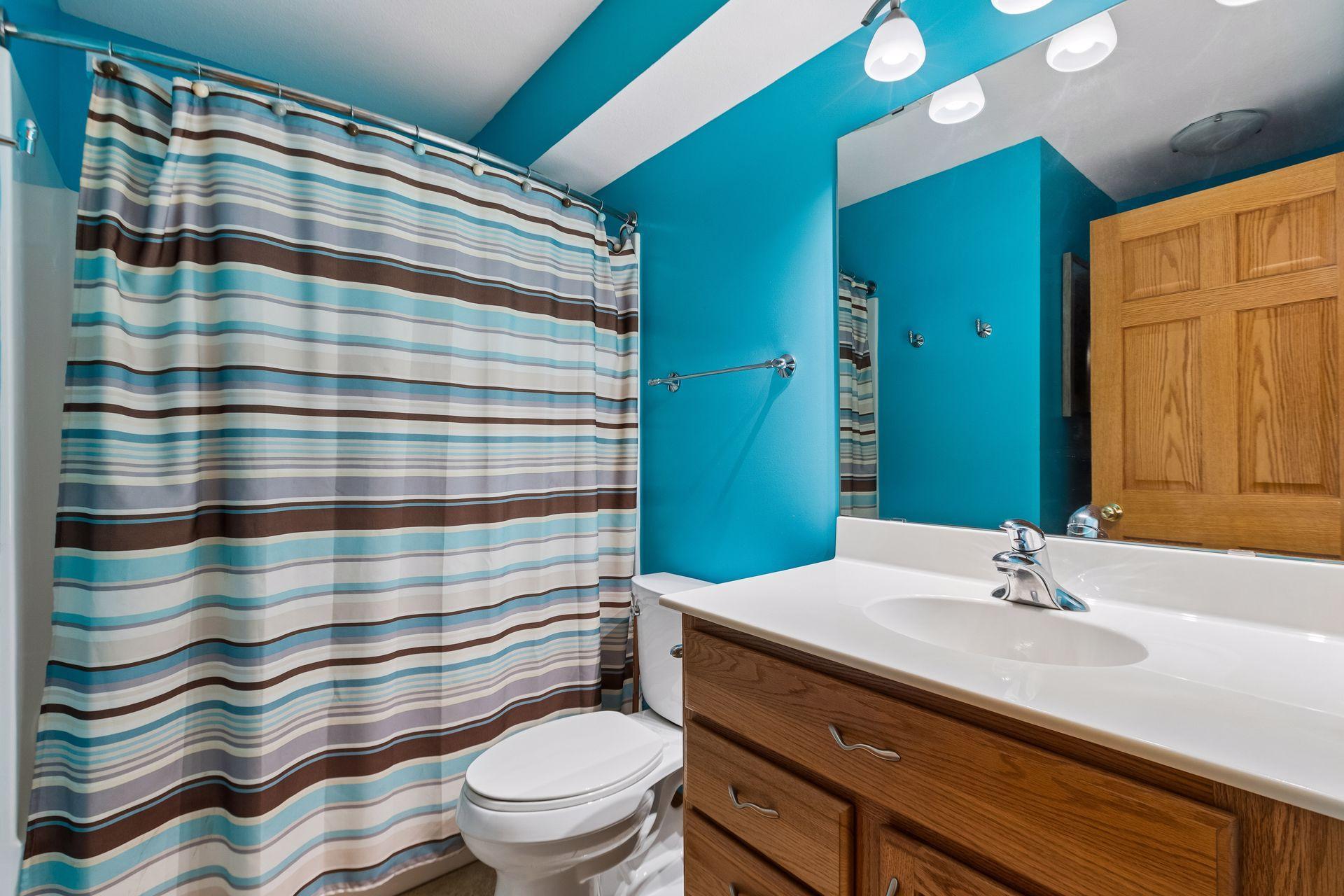 A convenient lower-level full bathroom adds functionality to this spacious walkout level.