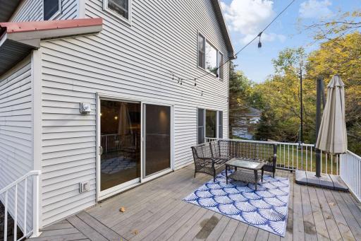 Step outside onto the spacious maintenance-free deck, an ideal place to entertain, dine outdoors, or simply enjoy the peaceful surroundings.