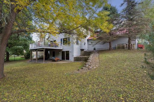 Looking back toward the home, you'll appreciate the expansive yard, impressive exterior, and spacious attached garage.