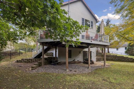 Convenient stairs connect the elevated deck to the backyard, making it easy to enjoy every inch of this wonderful outdoor space.