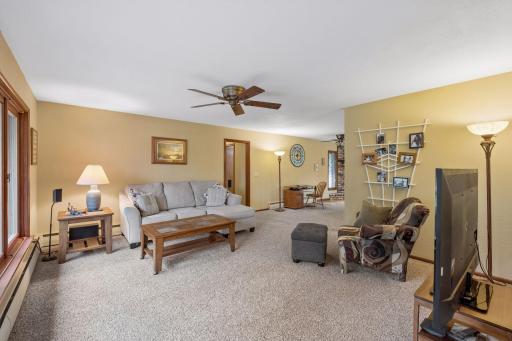 The open layout creates a seamless transition from the living room into the formal dining space, adding to the spacious feel of the main level.