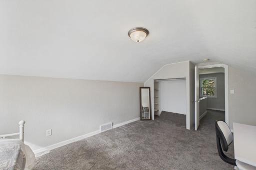 Upper-Level Bedroom with Open Flow, Closet & Hallway Access