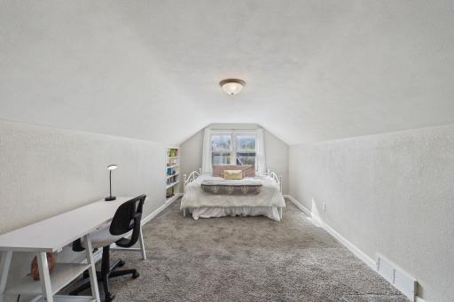 Spacious Upper-Level Bedroom with Oversized Rear Window