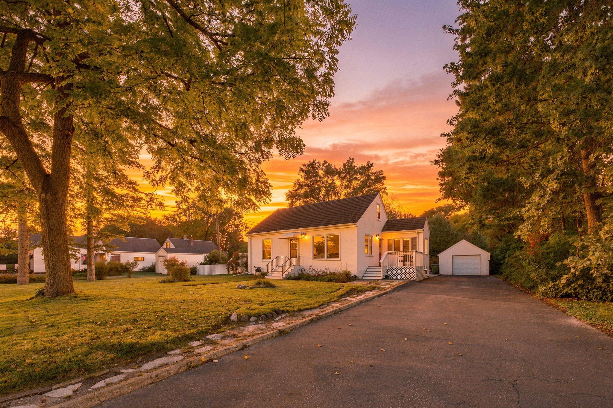 Twilight Front Exterior with Deck & Detached Garage