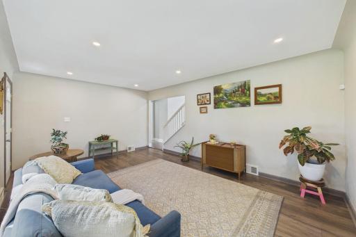 Open Family Room Flow with Stairway to Upper-Level Living Space