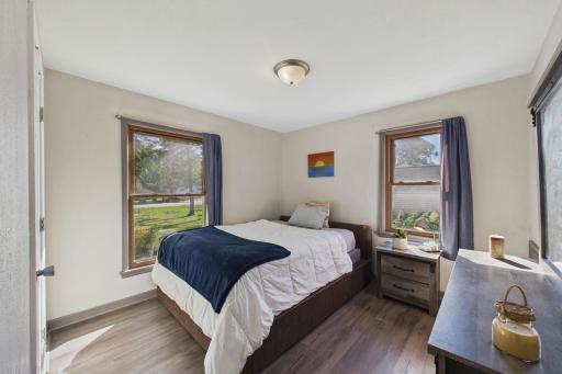 Bright Primary Bedroom with Two Large Windows