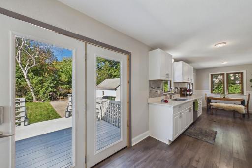 Seamless Kitchen-to-Backyard Flow with Expansive Deck Views