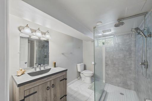 Basement Bath with Glass-Enclosed Walk-In Shower & Tile Floor