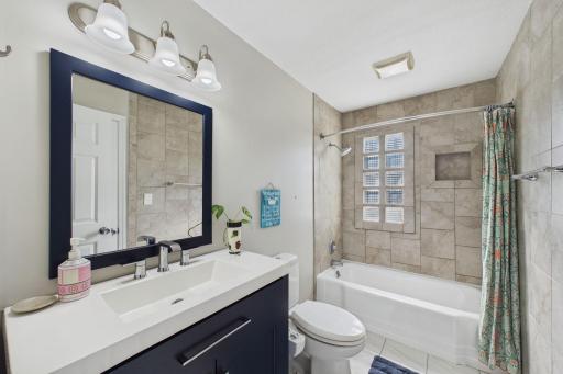 Updated Bath with Tile Surround & Natural Light-Enhancing Glass