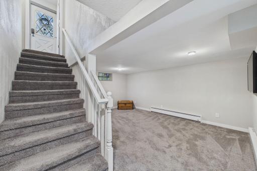 Basement Family Room with Stairway & Walkout to Front Deck