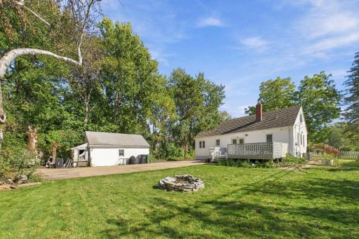 Lush Backyard with Expansive Deck, Fire Pit & Outdoor Entertaining Space