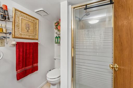 Lower-level 3/4 bath with nice, tiled floors