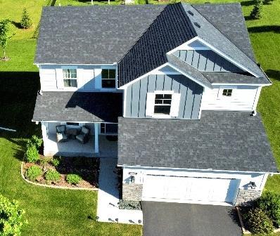 This ariel views showcases the interesting accents in the siding, store accents and the front porch on this property that sits on a corner lot.JPG