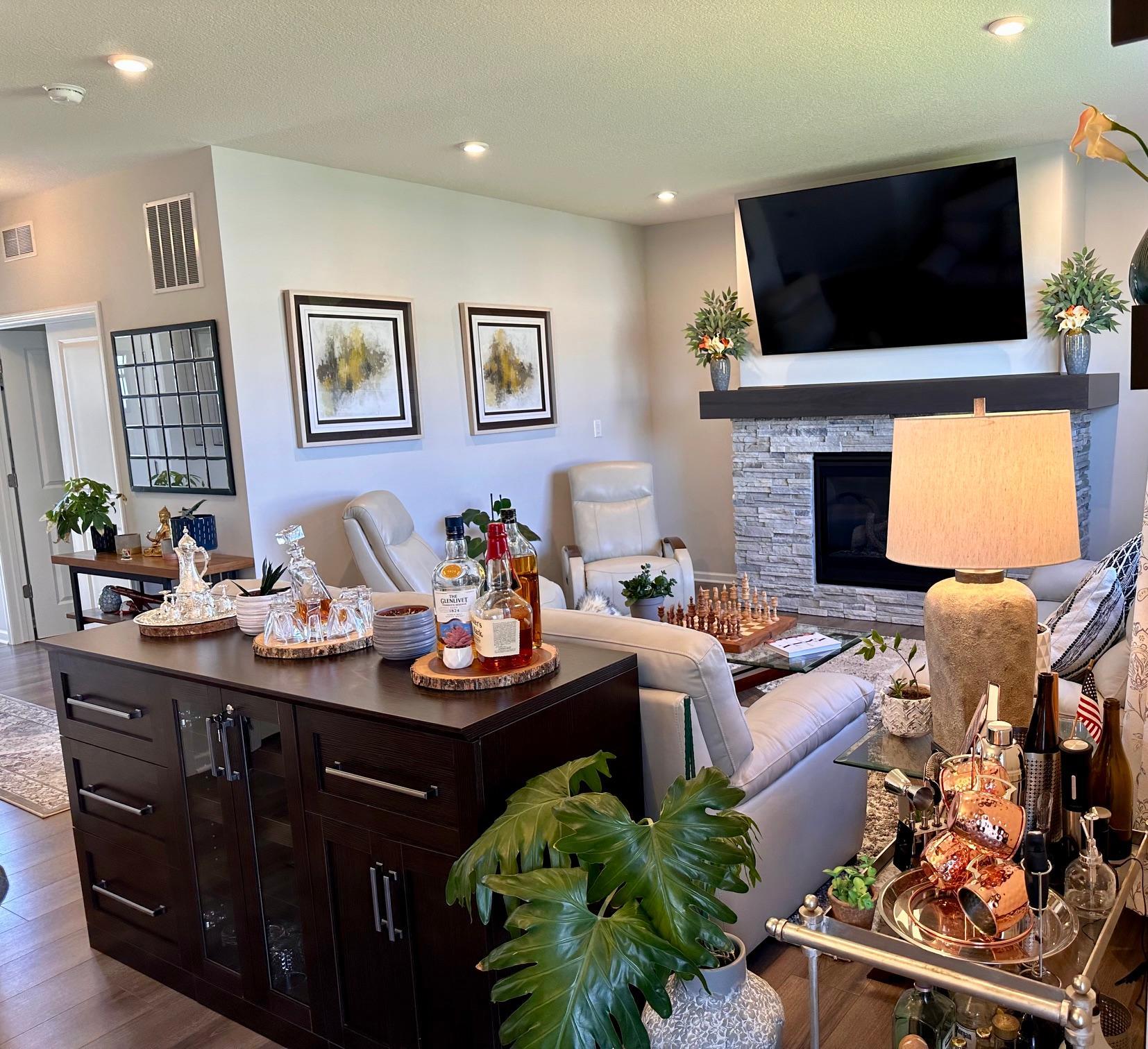 Livingroom/Family room with beautiful stacked-stone, gas fireplace. .jpeg