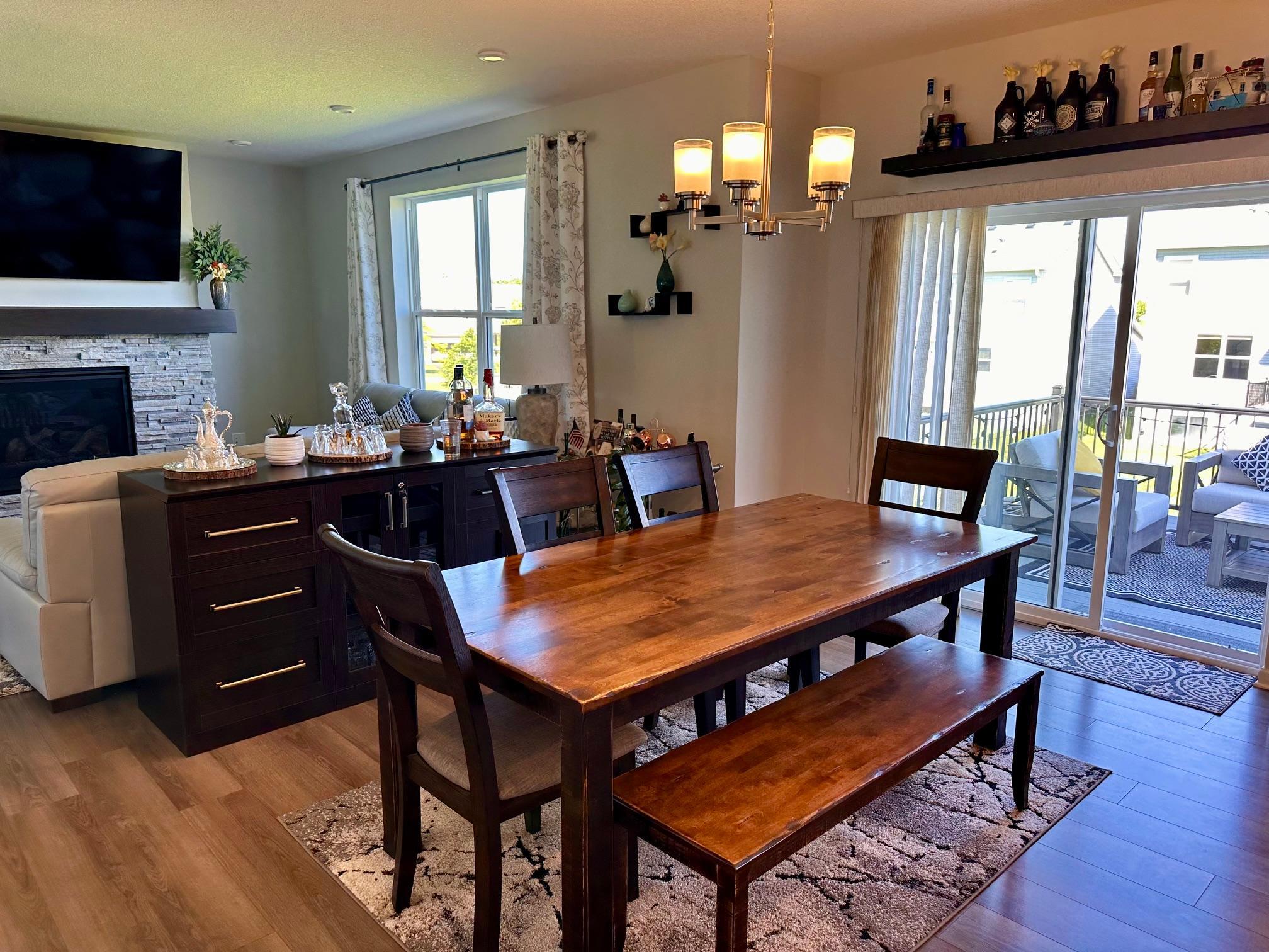 Open floorplan with informal dining room with sliding glass doors to outdoor deck.jpeg