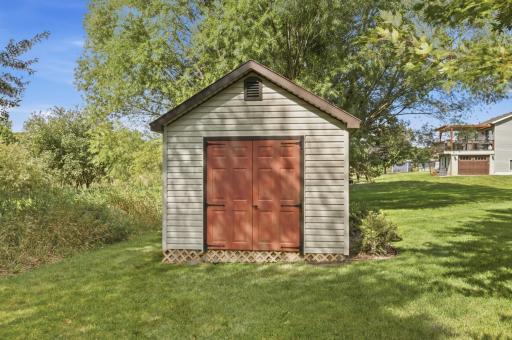 The 10' x 12' accessory shed adds even more useful storage, featuring a vaulted ceiling and double doors for easy lawn-equipment access.