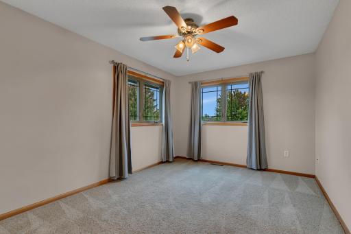Third bedroom on the upper level and it offers a spacious 5’ x 7’ walk-in closet.