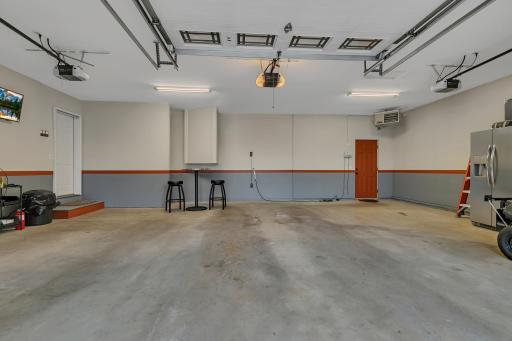 The entire garage is fully finished, insulated, taped, mudded, and heated with a Mr. Heater Big Max gas heater, creating a comfortable and functional space year-round.