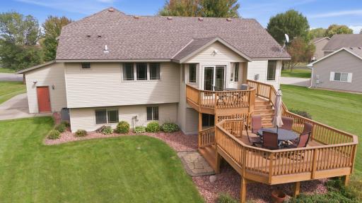 A garage service door provides convenient access to the backyard.