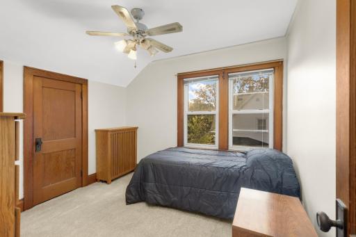 Second upper-level bedroom with brand-new carpet and natural light