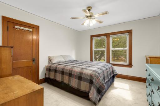 First upper-level bedroom with brand-new carpet and ample natural light