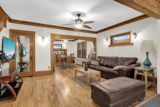 Open sightlines connect the living room and formal dining room