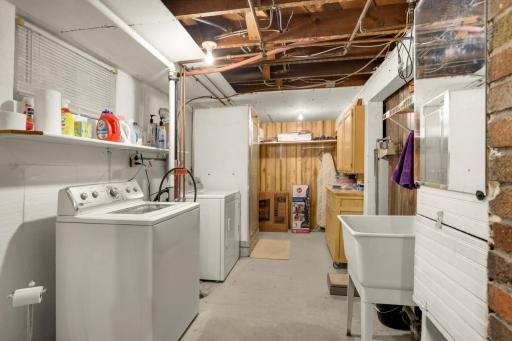 Lower-level laundry and utility area with washer and dryer