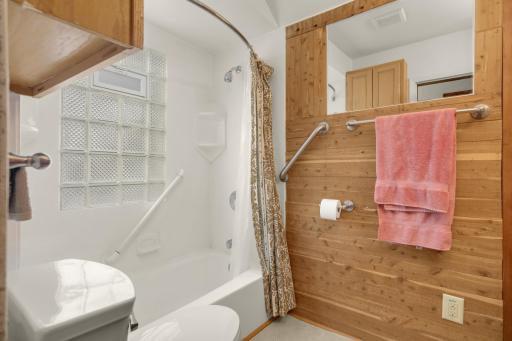 Full bathroom features a tub and shower combination and a new toilet