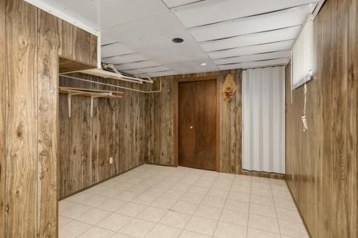Flexible lower-level room suitable for an office, exercise area, hobbies, or additional storage