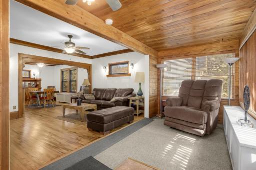 Sun-filled enclosed front porch offering additional seasonal living space