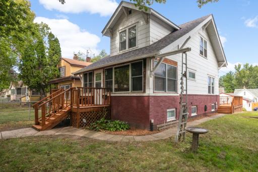 Welcoming front entry with a spacious wood deck